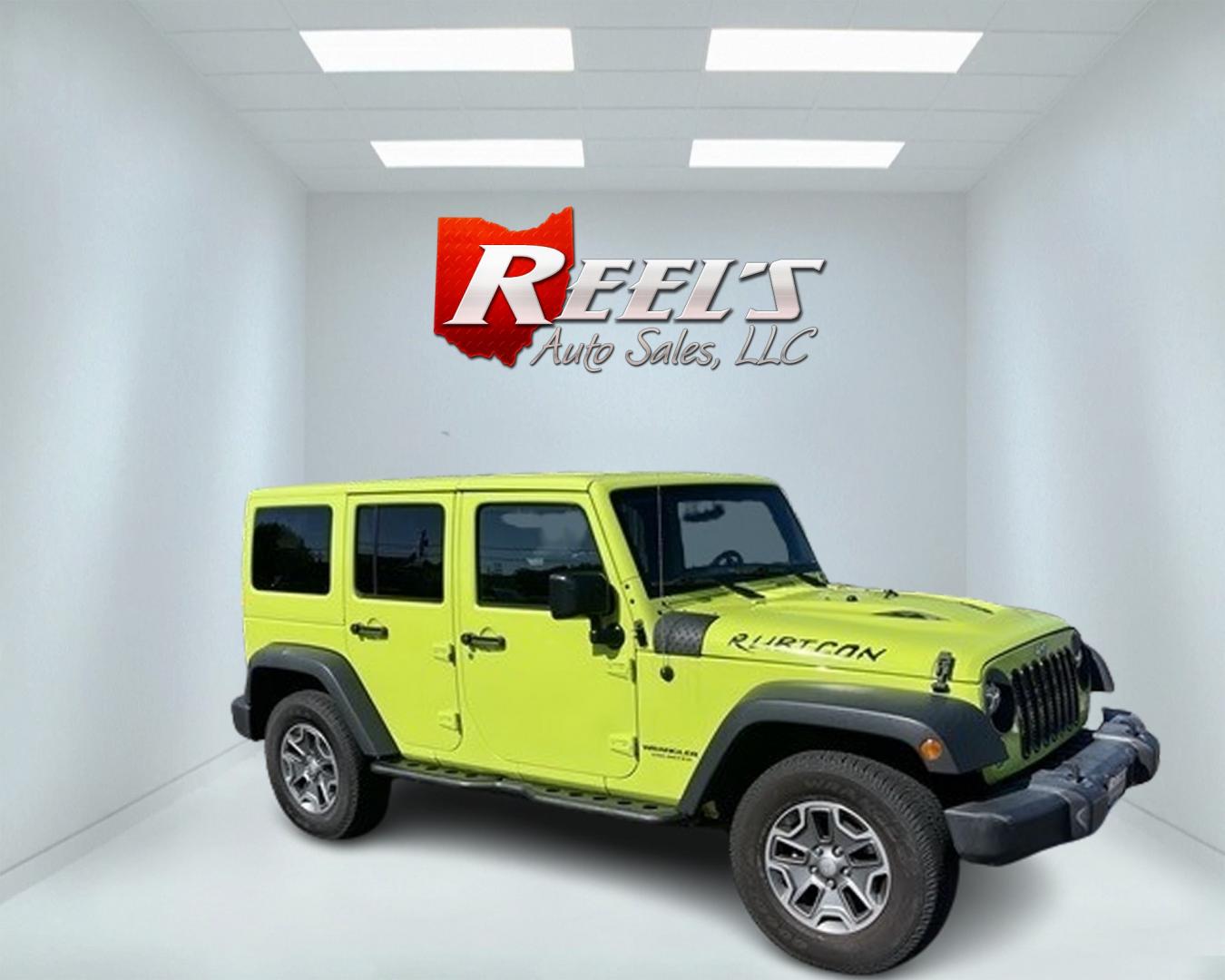 2017 Green /Black Jeep Wrangler Unlimited Rubicon 4WD (1C4BJWFG2HL) with an 3.6L V6 DOHC 24V engine, 5-Speed Automatic transmission, located at 11115 Chardon Rd. , Chardon, OH, 44024, (440) 214-9705, 41.580246, -81.241943 - This 2017 Jeep Wrangler Unlimited Rubicon is a rugged and capable off-road vehicle, equipped with a range of premium features. The exterior boasts LED headlights and fog lights, while the interior features a single-zone automatic climate control system, a 9-speaker Alpine sound system, and navigatio - Photo#3